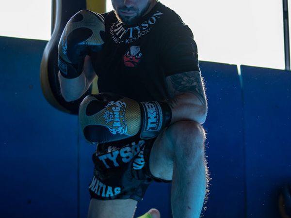 Calm and focused man preparing for a workout session in a serene environment.